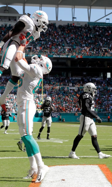 Trick plays help unbeaten Dolphins beat Raiders 28-20